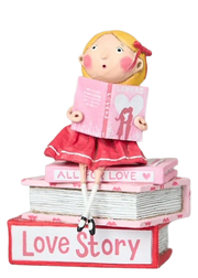 Hand-painted “Love Story” figurine by Lori Mitchell—sweet girl in pink and red dress perched atop a stack of romance books, lost in a love story
